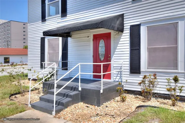 a view of a big room with windows and closet