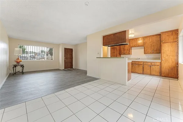 a view of kitchen with furniture and wooden floor