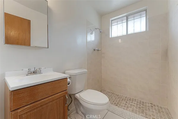 a bathroom with a sink toilet and vanity