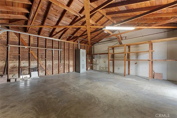 a view of an empty room with wooden walls