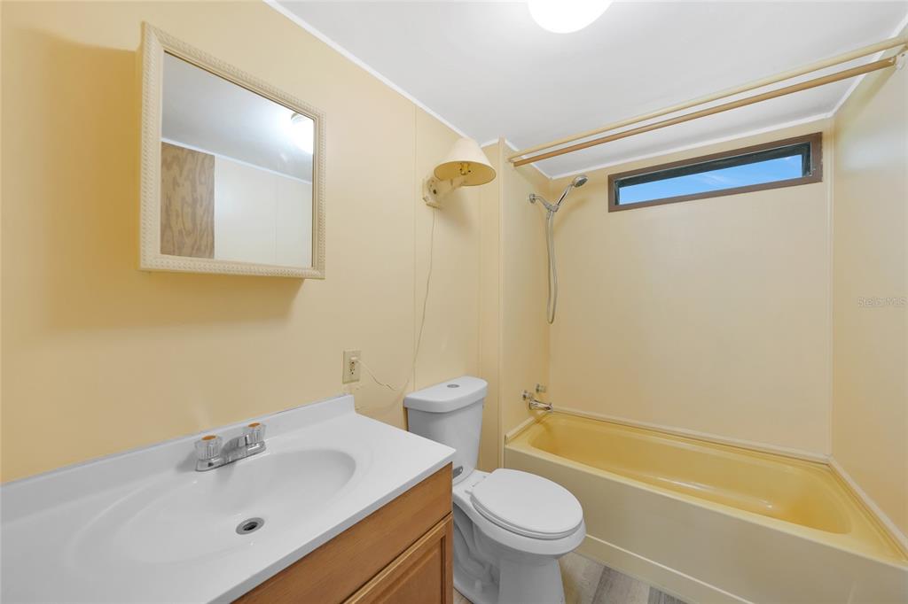 1298 Southeast Lake Road Arcadia, FL 34266 - Photo 13 of 35 a bathroom with a sink toilet and shower