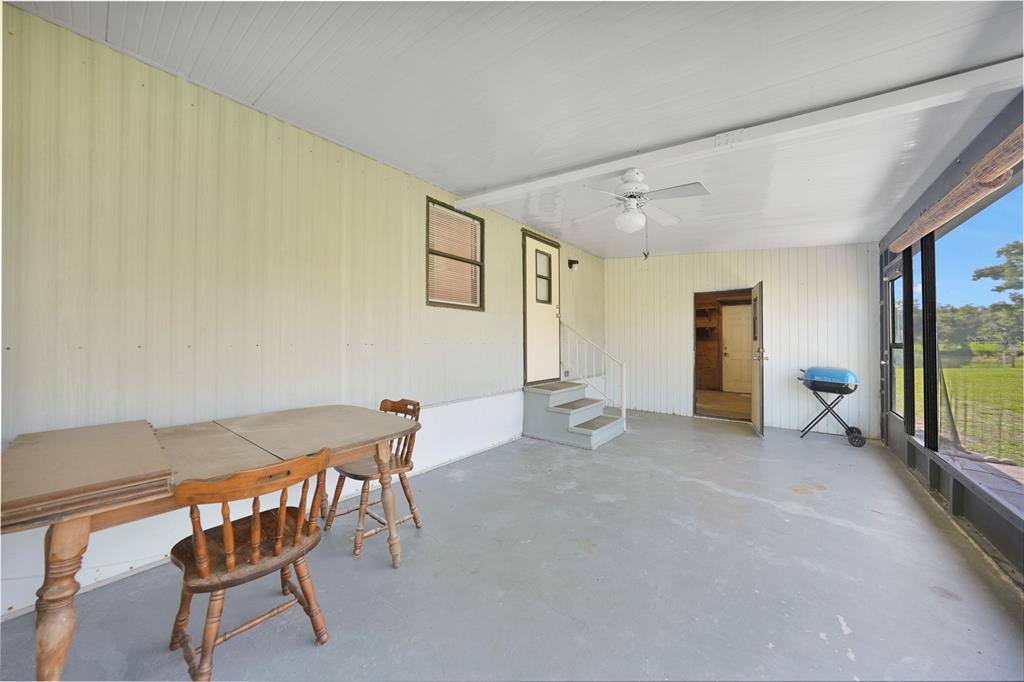 1298 Southeast Lake Road Arcadia, FL 34266 - Photo 23 of 35 a view of a livingroom with furniture and a ceiling fan