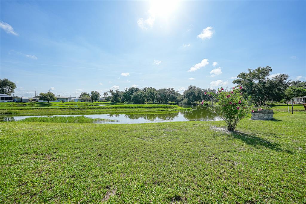 1298 Southeast Lake Road Arcadia, FL 34266 - Photo 27 of 35 a view of a golf course with a lake