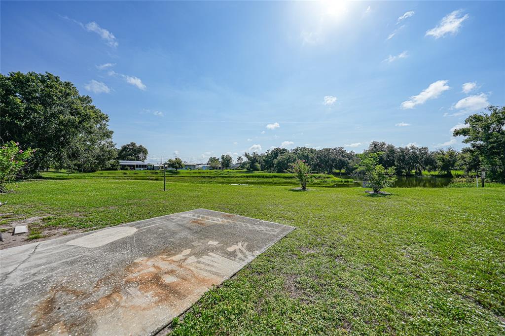 1298 Southeast Lake Road Arcadia, FL 34266 - Photo 28 of 35 a view of a golf course with a garden