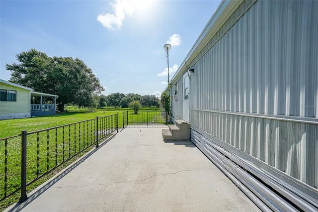 a view of backyard with green space