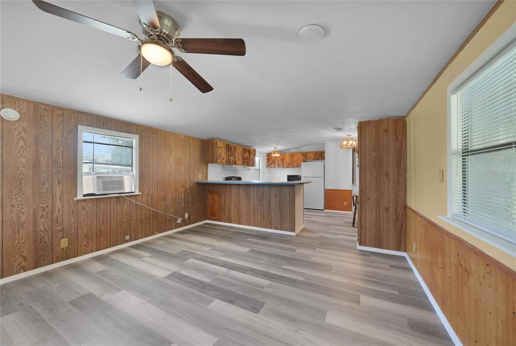 1298 Southeast Lake Road Arcadia, FL 34266 - Photo 5 of 35 a view of empty room with wooden floor and fan