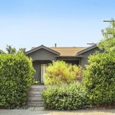 a house with trees in front of it