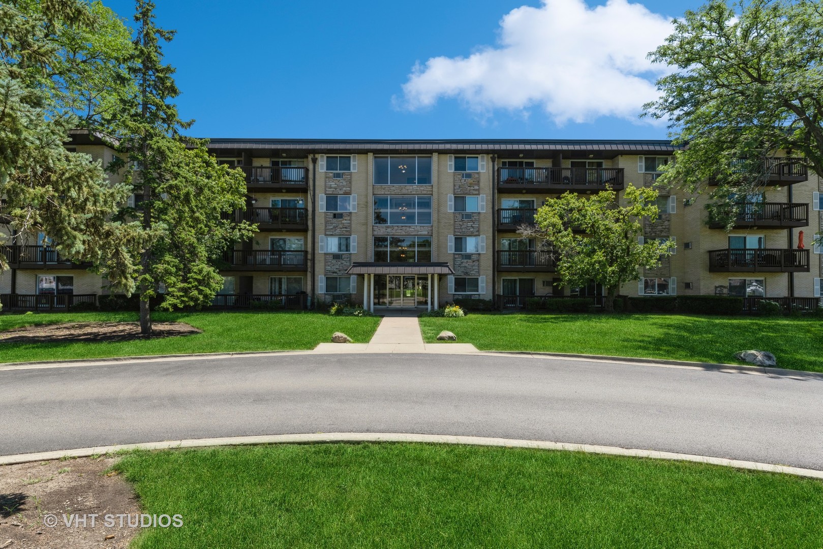 2214 South Goebbert Road, Unit 478 Arlington Heights, IL 60005 - Photo 1 of 14 a view of a house with a yard