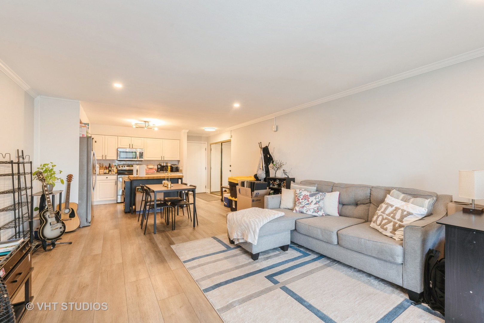 2214 South Goebbert Road, Unit 478 Arlington Heights, IL 60005 - Photo 3 of 14 a living room with furniture and a table
