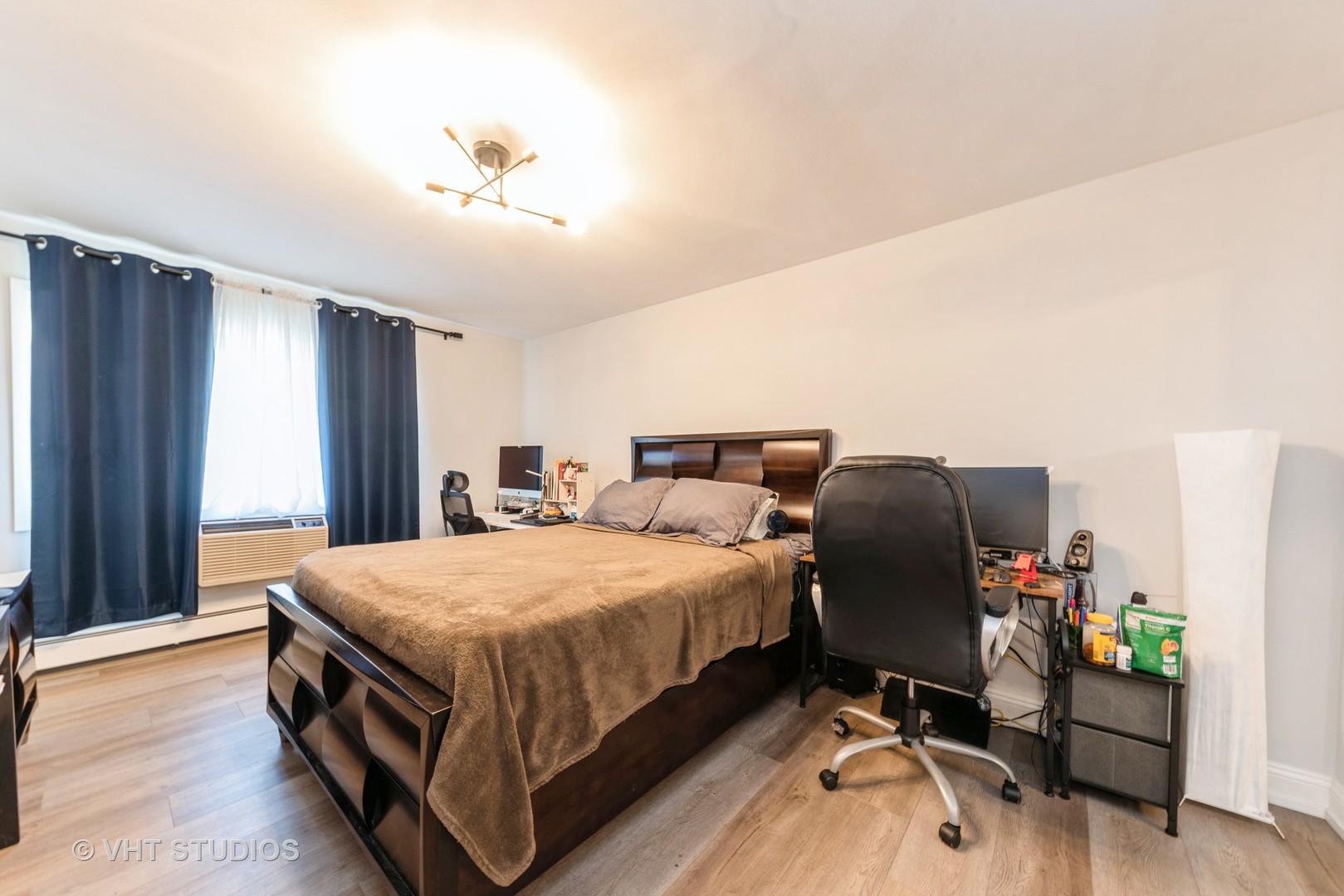 2214 South Goebbert Road, Unit 478 Arlington Heights, IL 60005 - Photo 7 of 14 a bed room with a bed and a chair