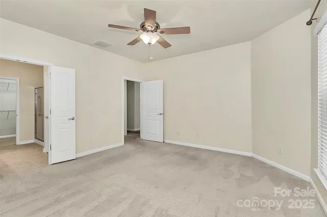 a view of an empty room with a bathroom