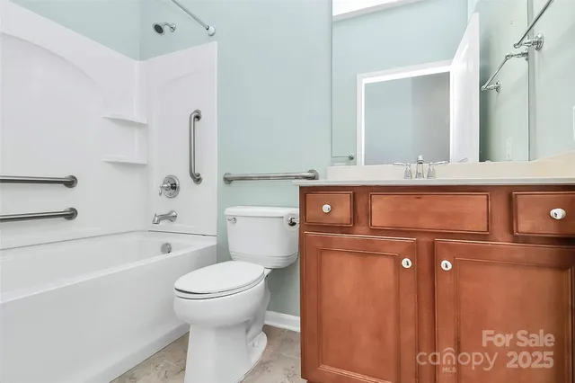 a bathroom with a bathtub and a toilet