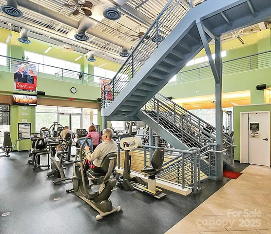 a view of a pool table and chairs in wooden floor
