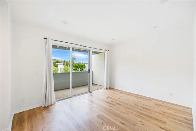 a bathroom with a shower sink vanity mirror and toilet