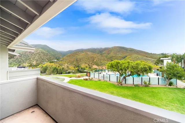a spacious bathroom with a granite countertop sink a mirror and a