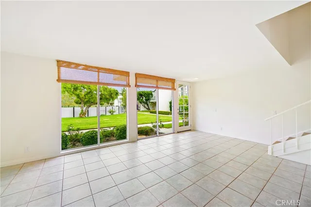 a view of an empty room with a large window