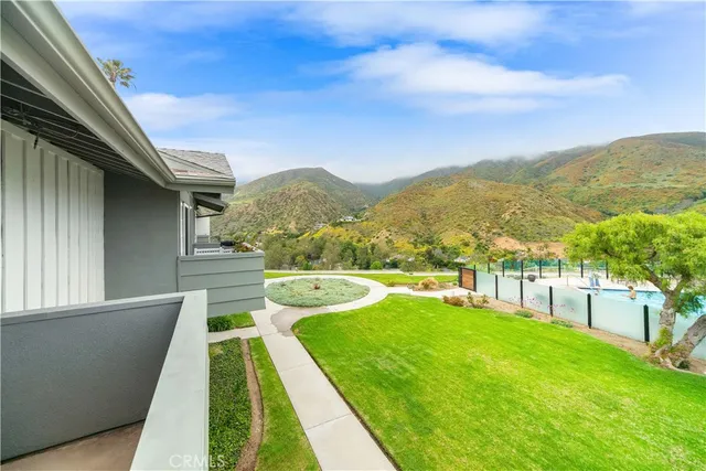 an empty room with wooden floor and a window