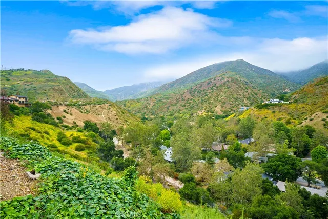 a view of a patio with tables and chairs