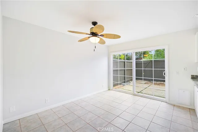 a kitchen with stainless steel appliances granite countertop a stove top oven a refrigerator a sink and dishwasher