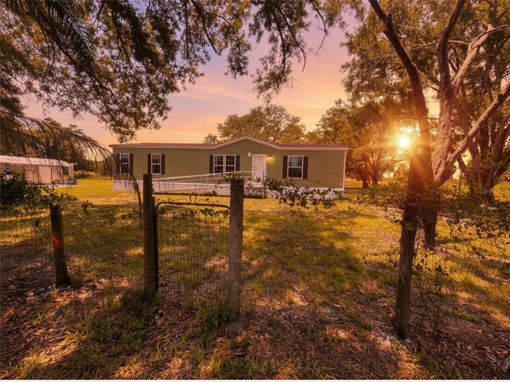 9827 Southeast Hoth Road Arcadia, FL 34266 - Photo 2 of 28 a view of a house with backyard