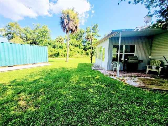 a view of a backyard of the house