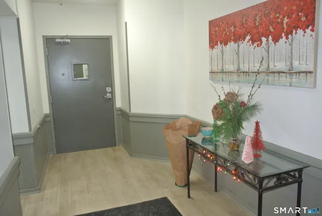 a room with furniture and a potted plant