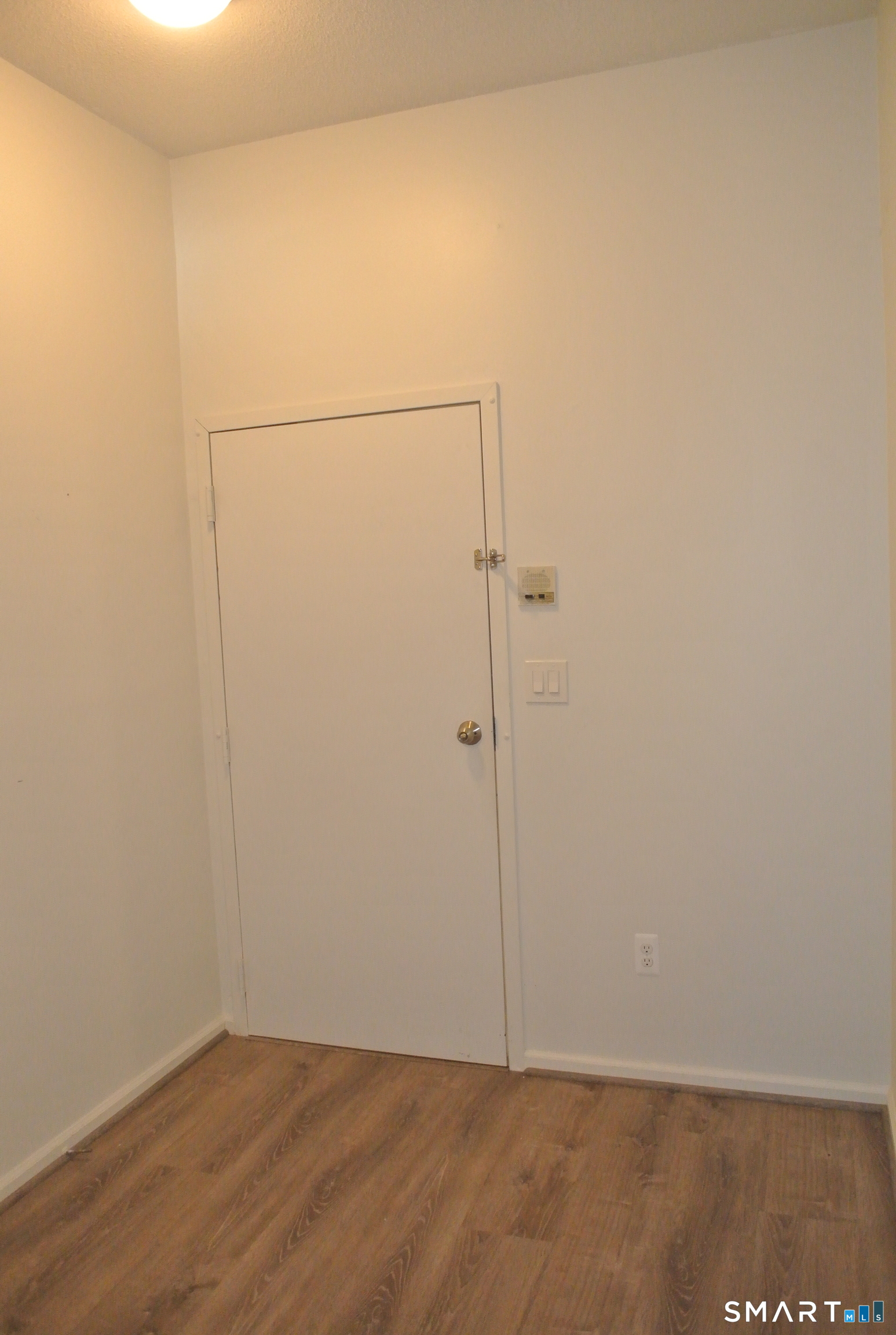 146 High Street, Unit 303 Milford, CT 06460 - Photo 3 of 17 a view of small space with wooden floor