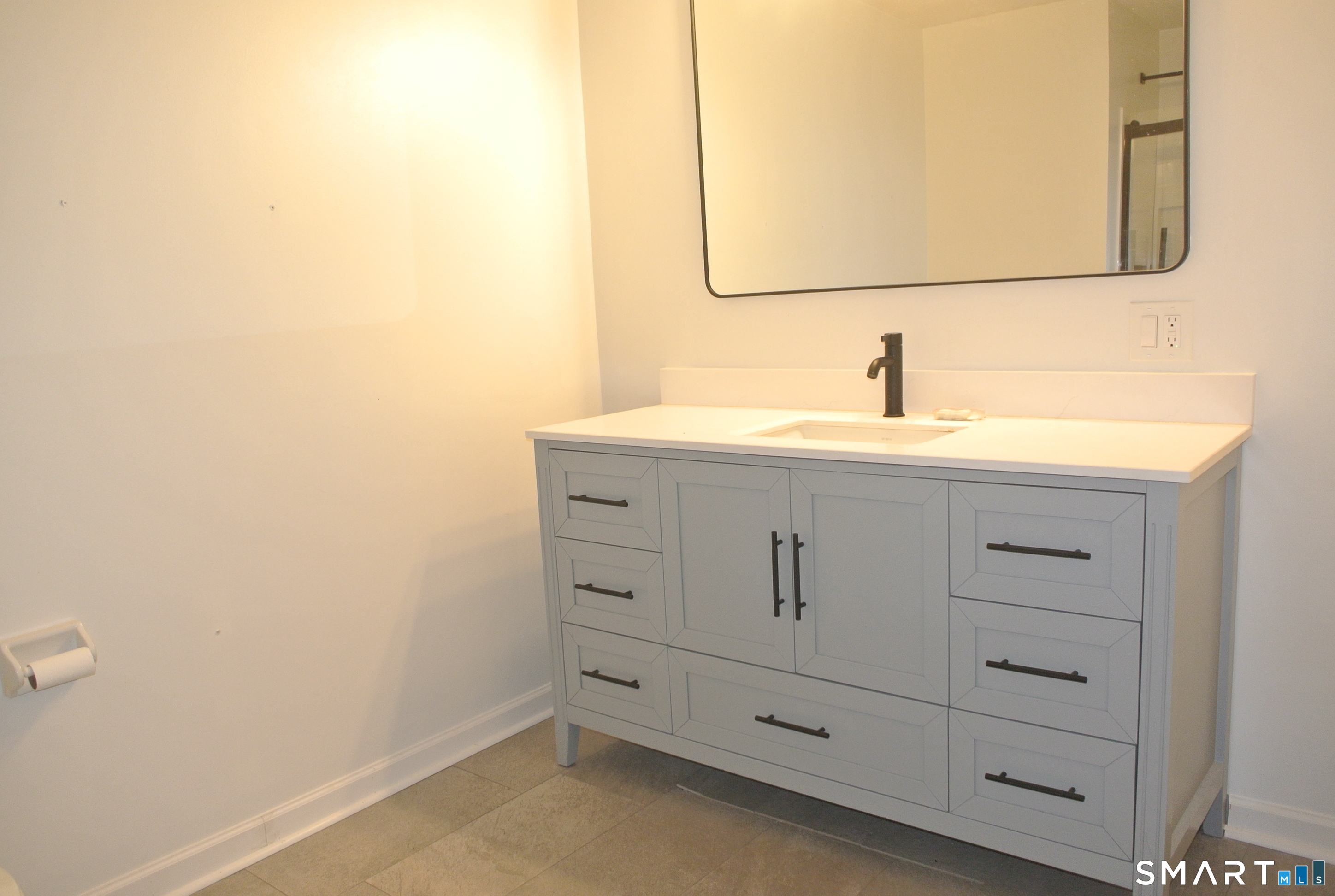 146 High Street, Unit 303 Milford, CT 06460 - Photo 6 of 17 a bathroom with a sink and a mirror