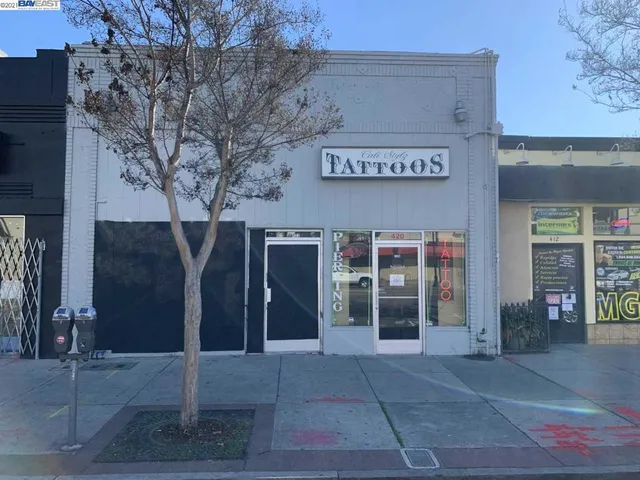 a view of a building with retail shops