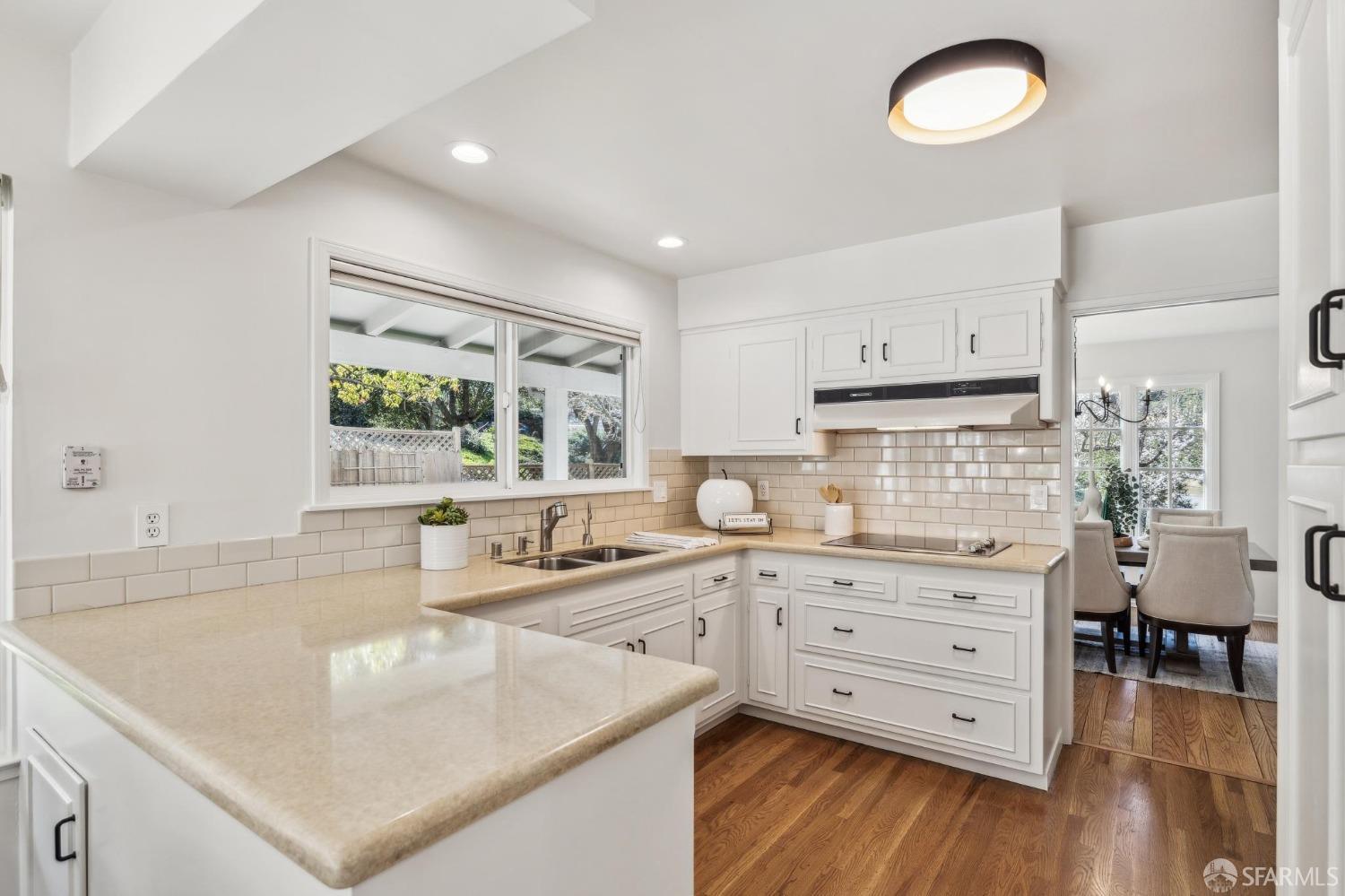 4 La Cuesta Road Orinda, CA 94563 - Photo 12 of 50 a kitchen with a stove a sink and a refrigerator