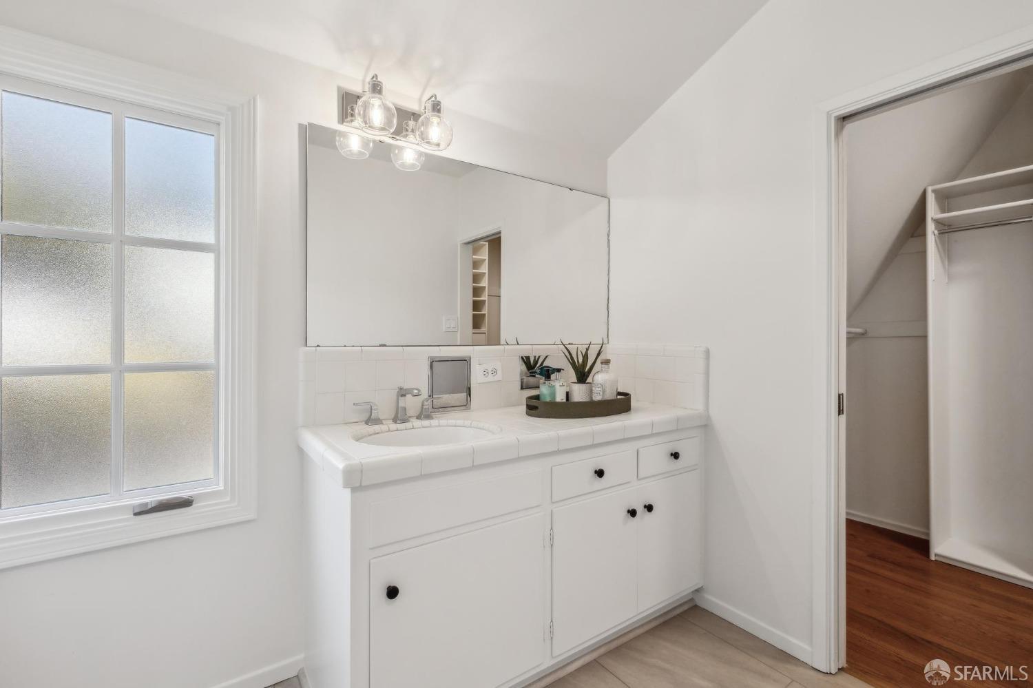 4 La Cuesta Road Orinda, CA 94563 - Photo 23 of 50 a bathroom with a sink vanity and mirror