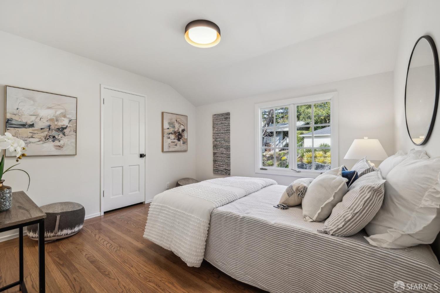 4 La Cuesta Road Orinda, CA 94563 - Photo 28 of 50 a bedroom with a bed a table and painting on the wall