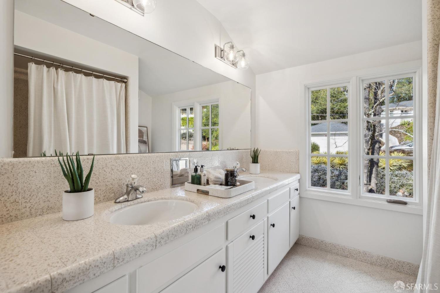 4 La Cuesta Road Orinda, CA 94563 - Photo 33 of 50 a bathroom with double vanity and a mirror
