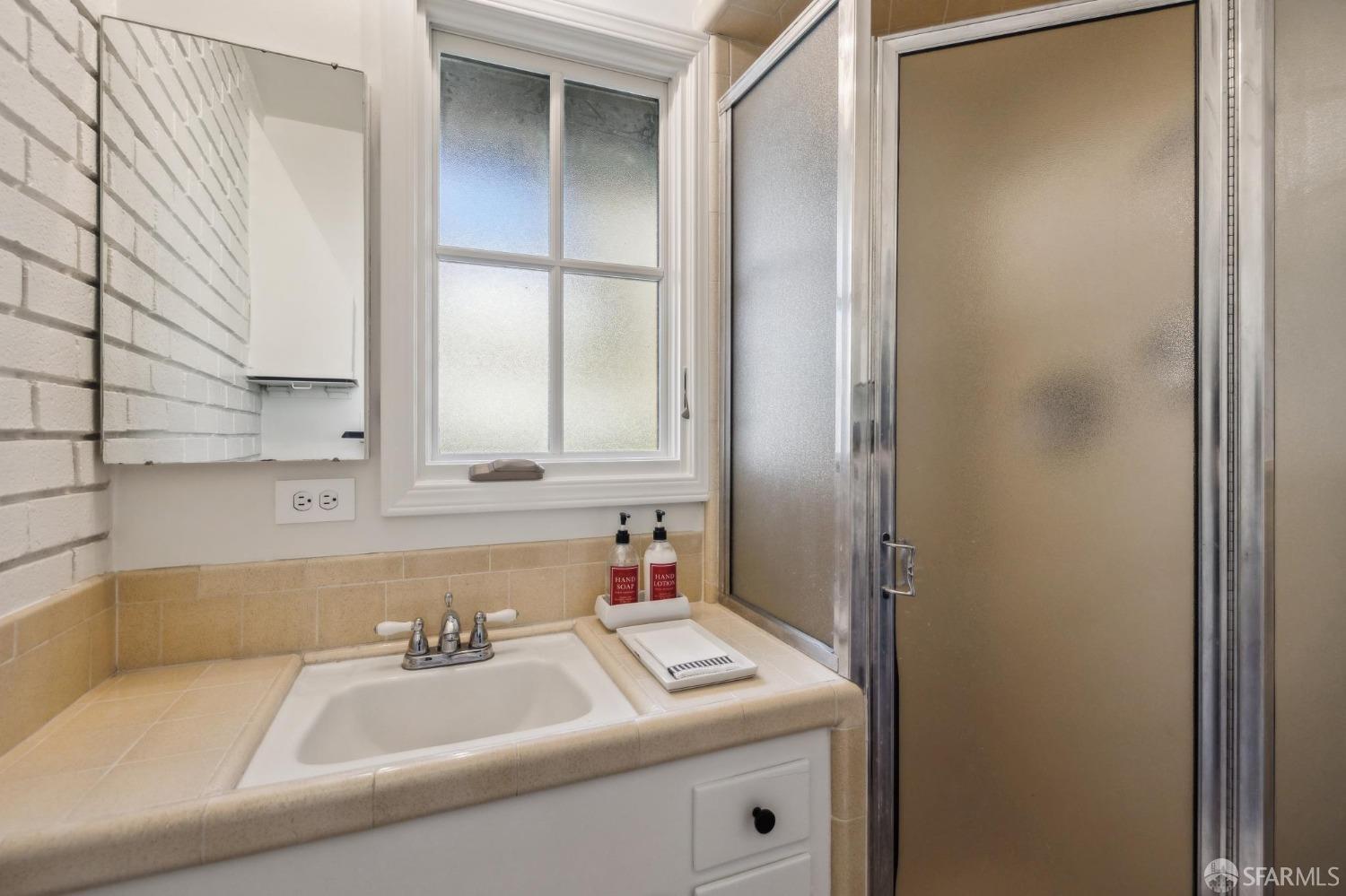 4 La Cuesta Road Orinda, CA 94563 - Photo 36 of 50 a bathroom with a sink and a mirror