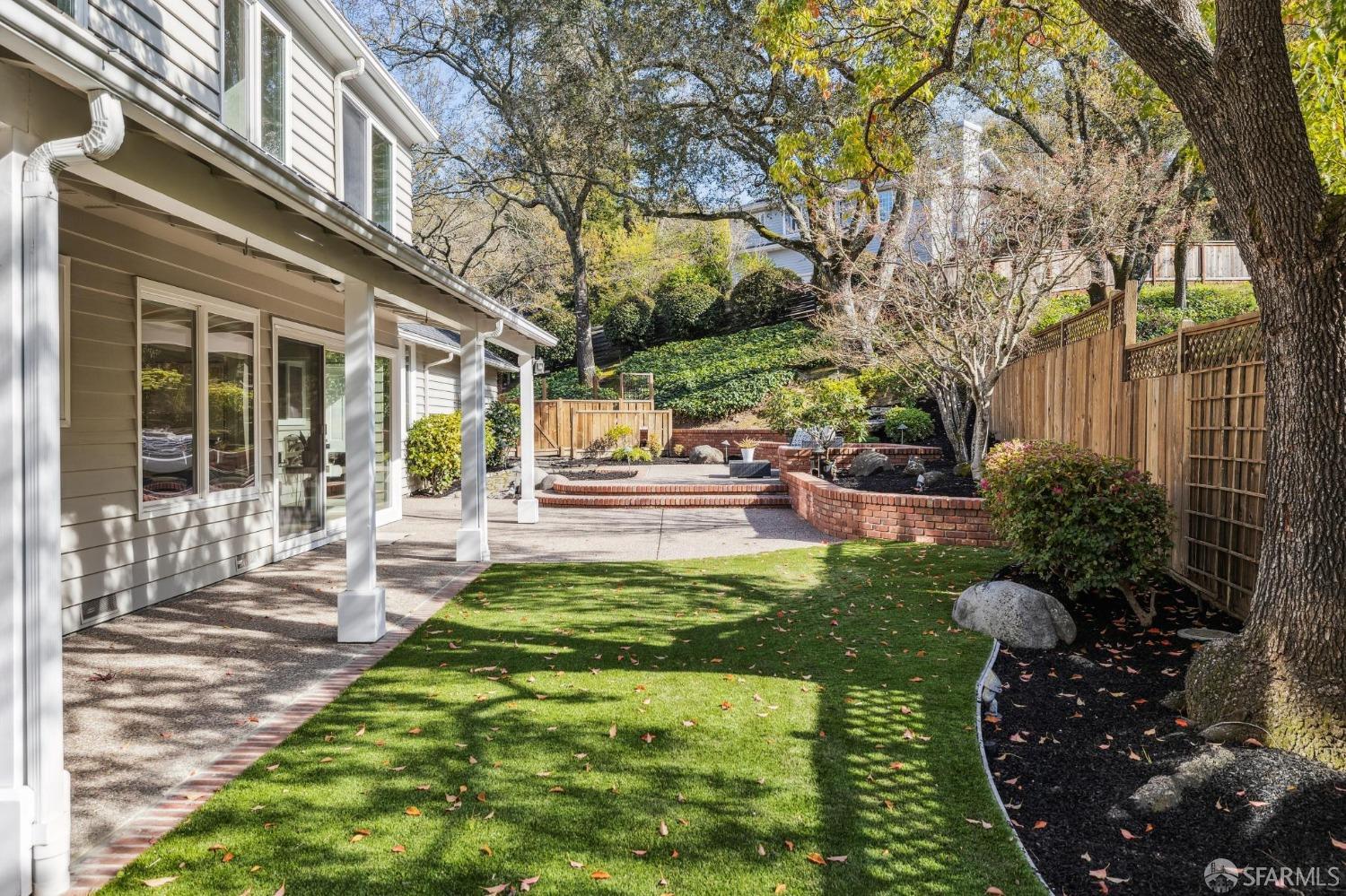 4 La Cuesta Road Orinda, CA 94563 - Photo 39 of 50 a view of a patio with table and chairs potted plants and large tree