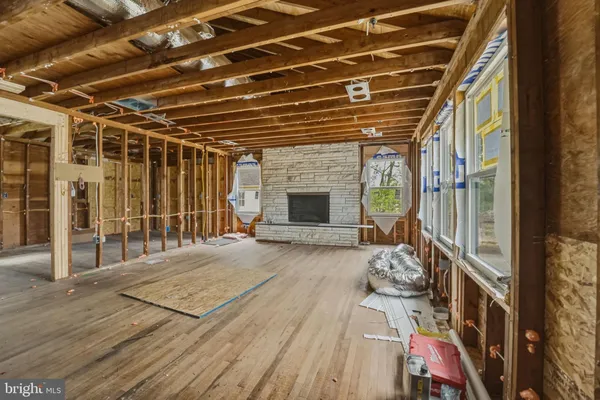 a view of a room with wooden floor