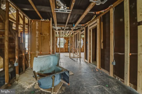 a view of bathroom with a tub and shower