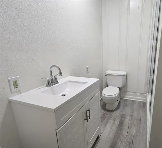 a bathroom with a shower and a toilet