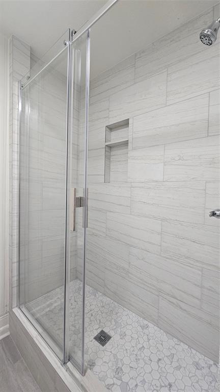 1015 South Welch Street, Unit A Denton, TX 76201 - Photo 13 of 21 a bathroom with a shower