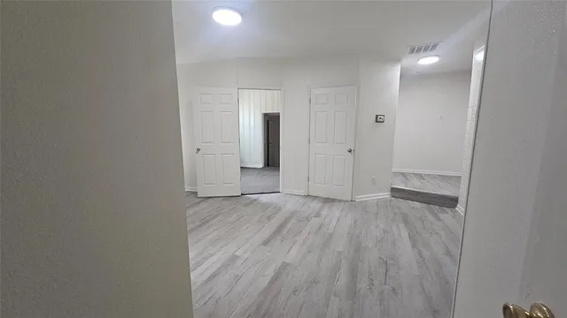 a view of a livingroom with wooden floor