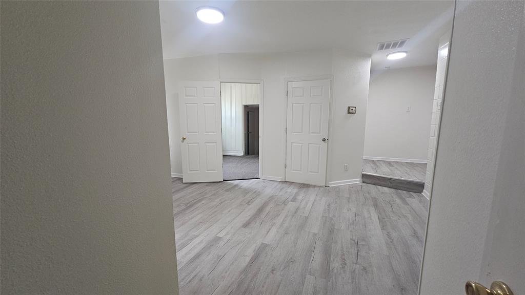 1015 South Welch Street, Unit A Denton, TX 76201 - Photo 2 of 21 a view of a livingroom with wooden floor