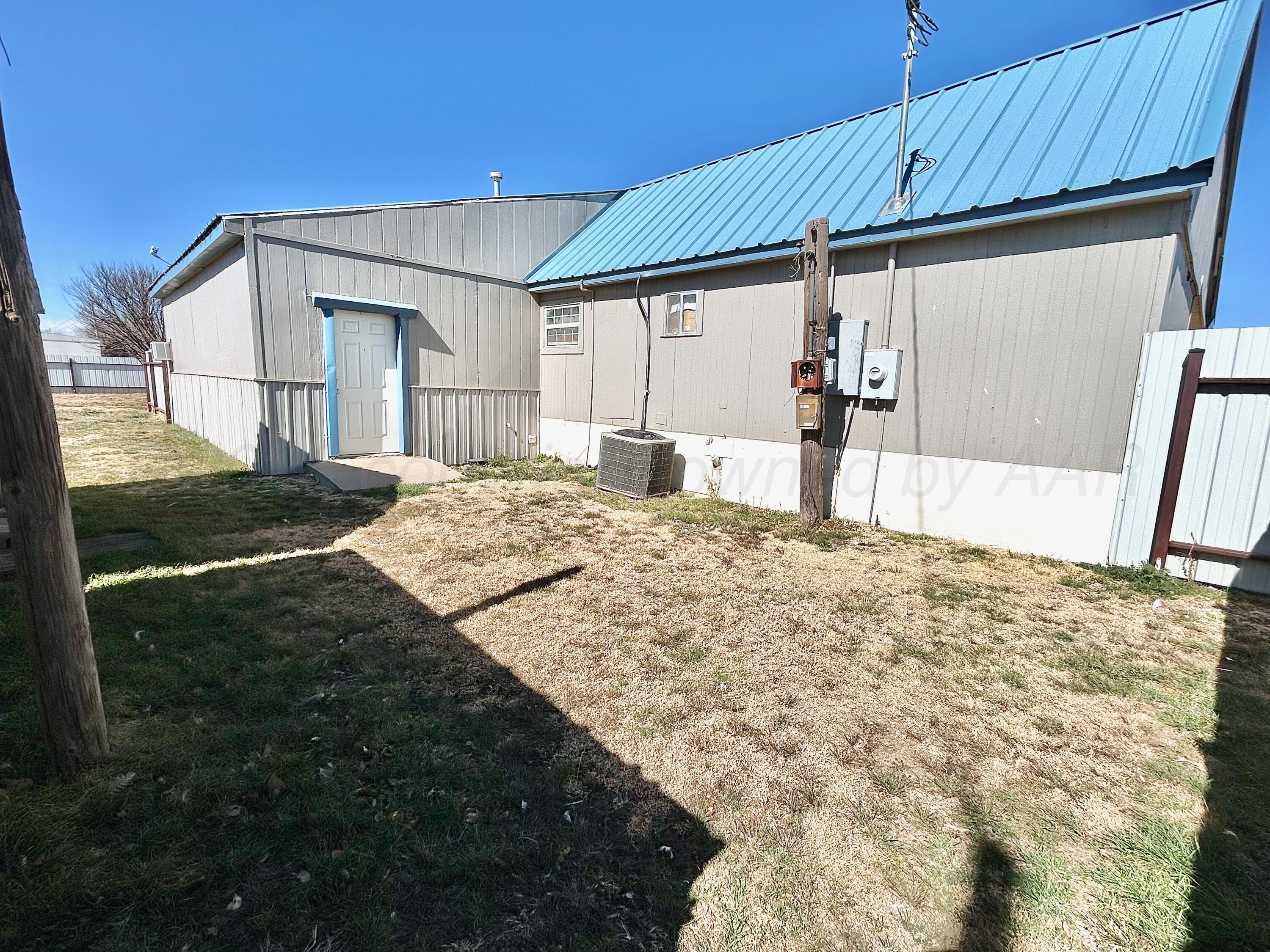 101 Gaines Street Claude, TX 79019 - Photo 14 of 18 a view of a backyard of the house