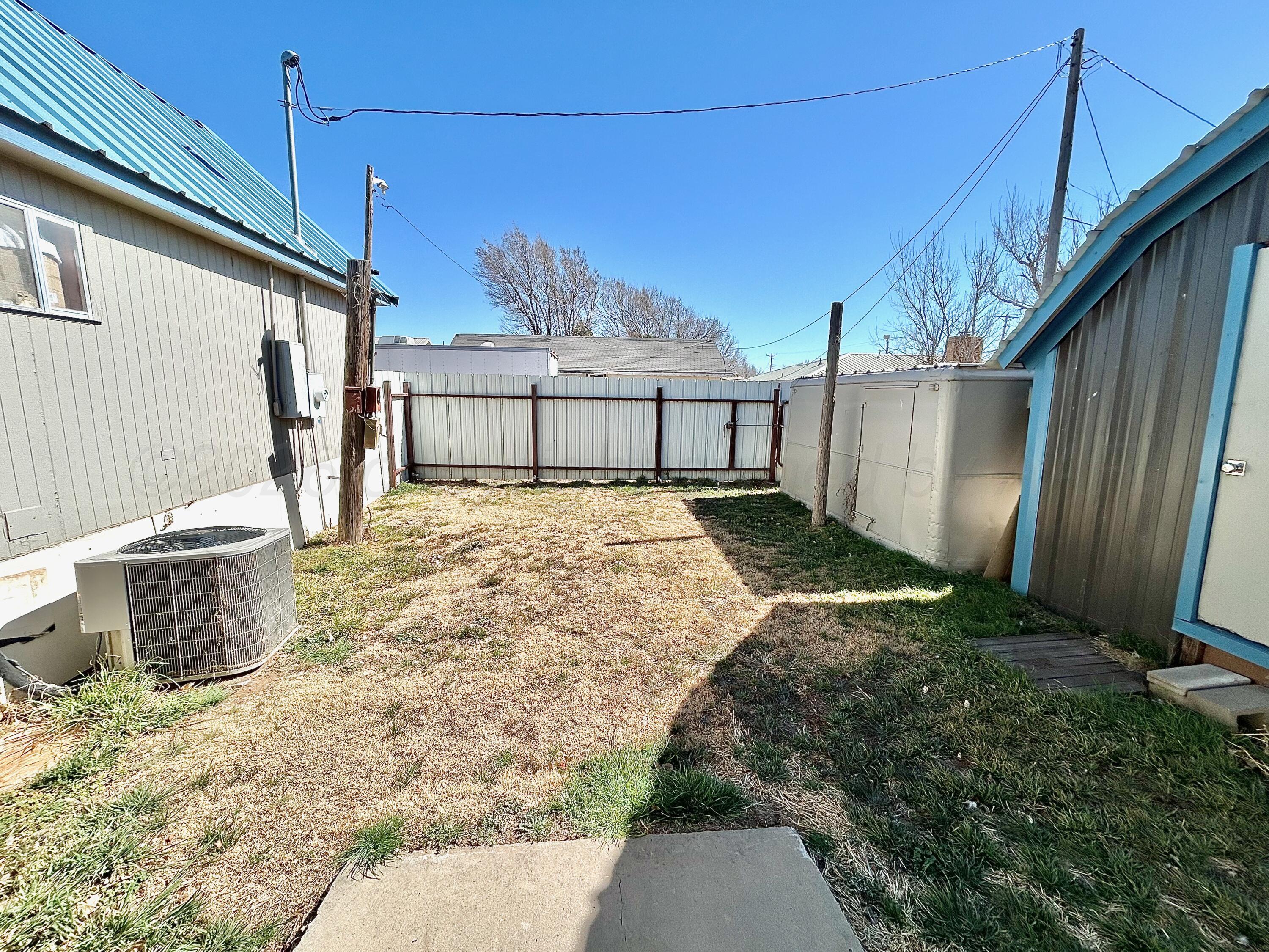 101 Gaines Street Claude, TX 79019 - Photo 17 of 18 a view of a backyard