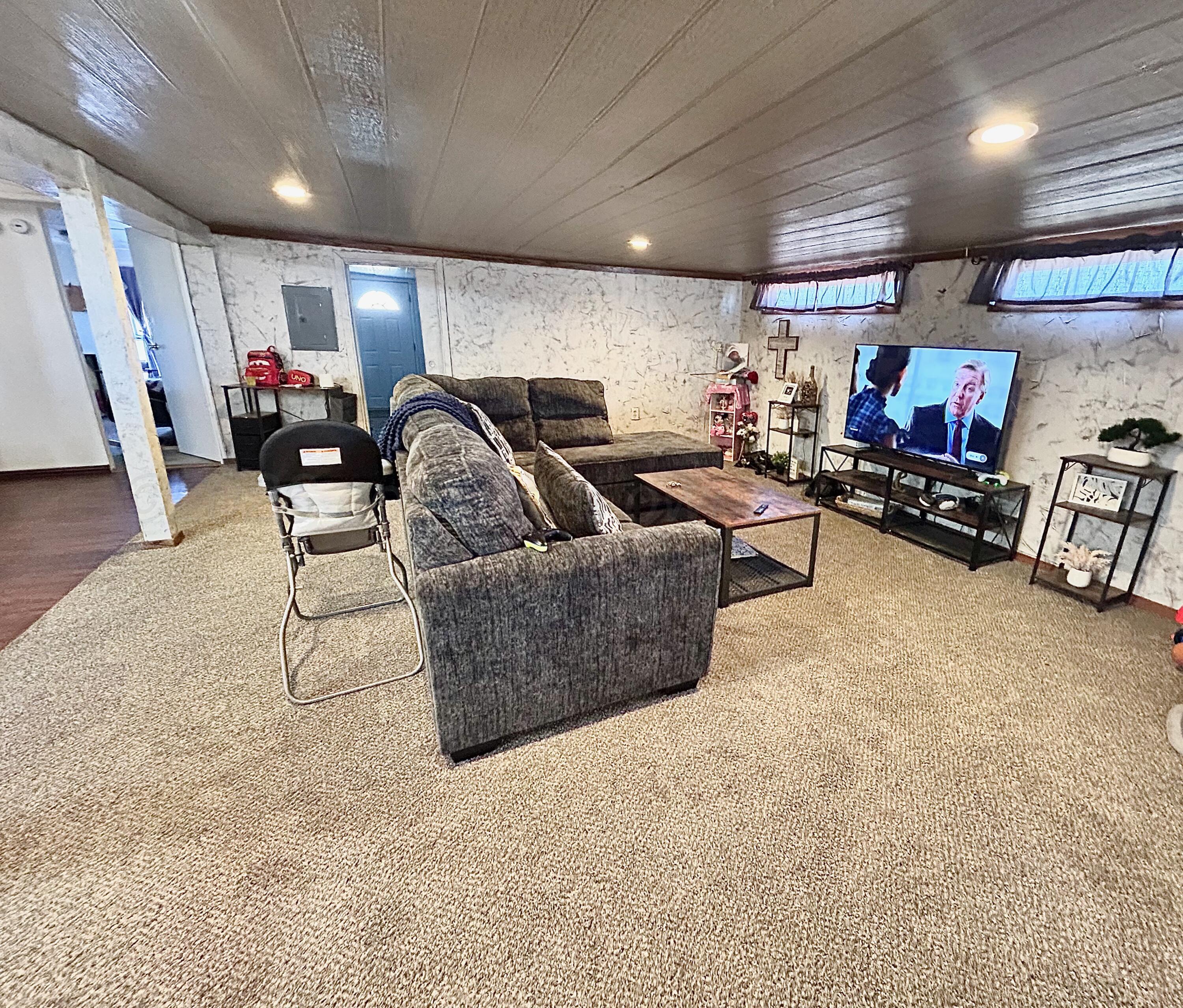 101 Gaines Street Claude, TX 79019 - Photo 2 of 18 a living room with furniture and a flat screen tv