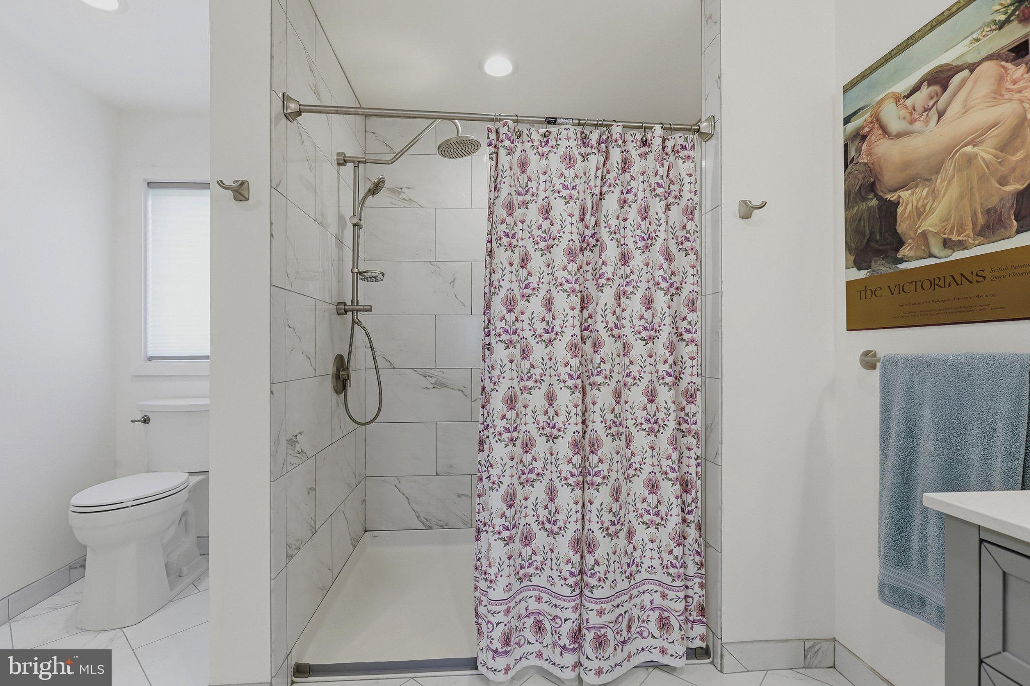 6495 Tides Road King George, VA 22485 - Photo 22 of 65 a bathroom with a shower curtain