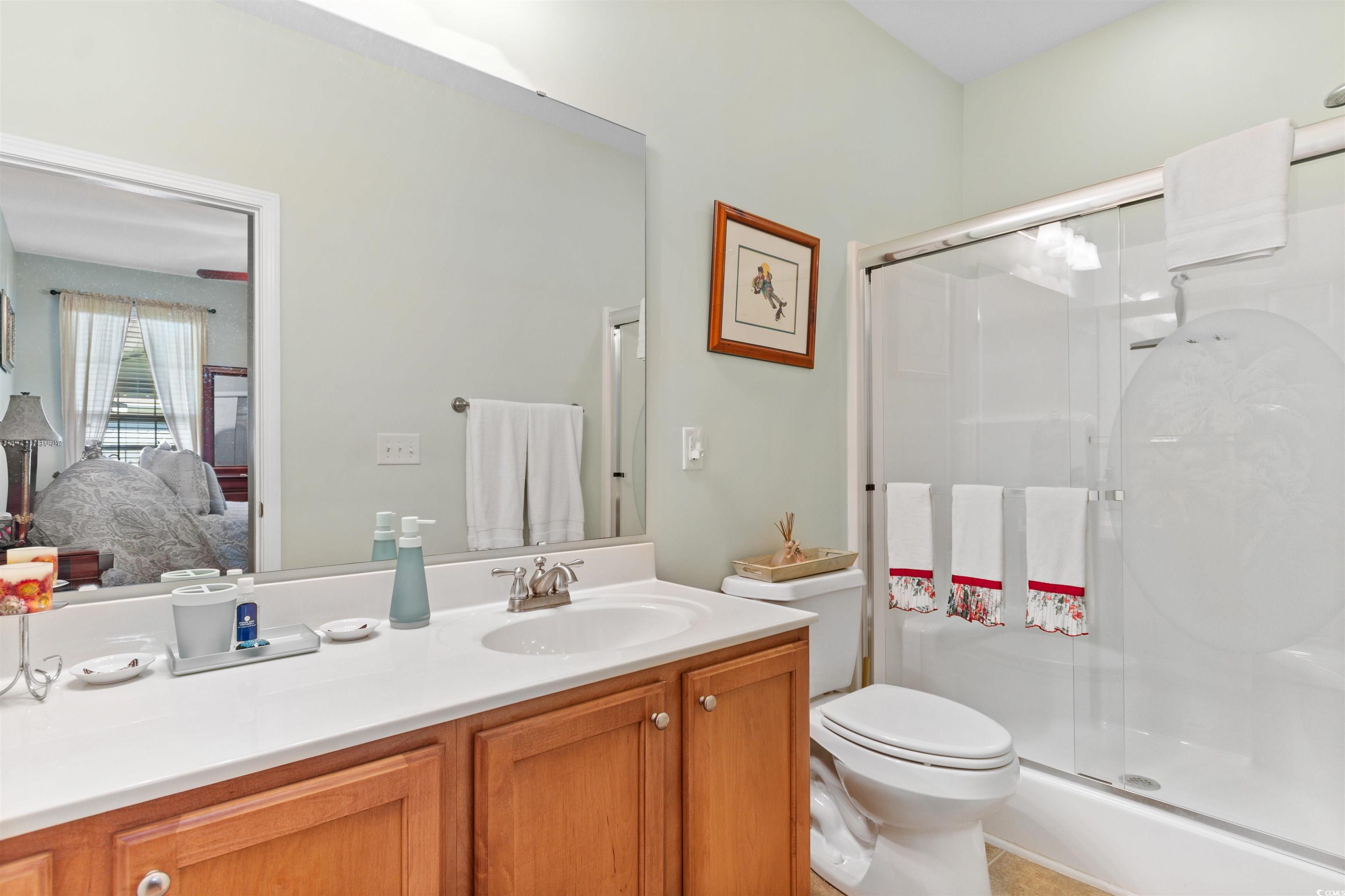 519 Heritage Point Drive Myrtle Beach, SC 29588 - Photo 15 of 39 Ensuite bathroom featuring a shower stall and vanity