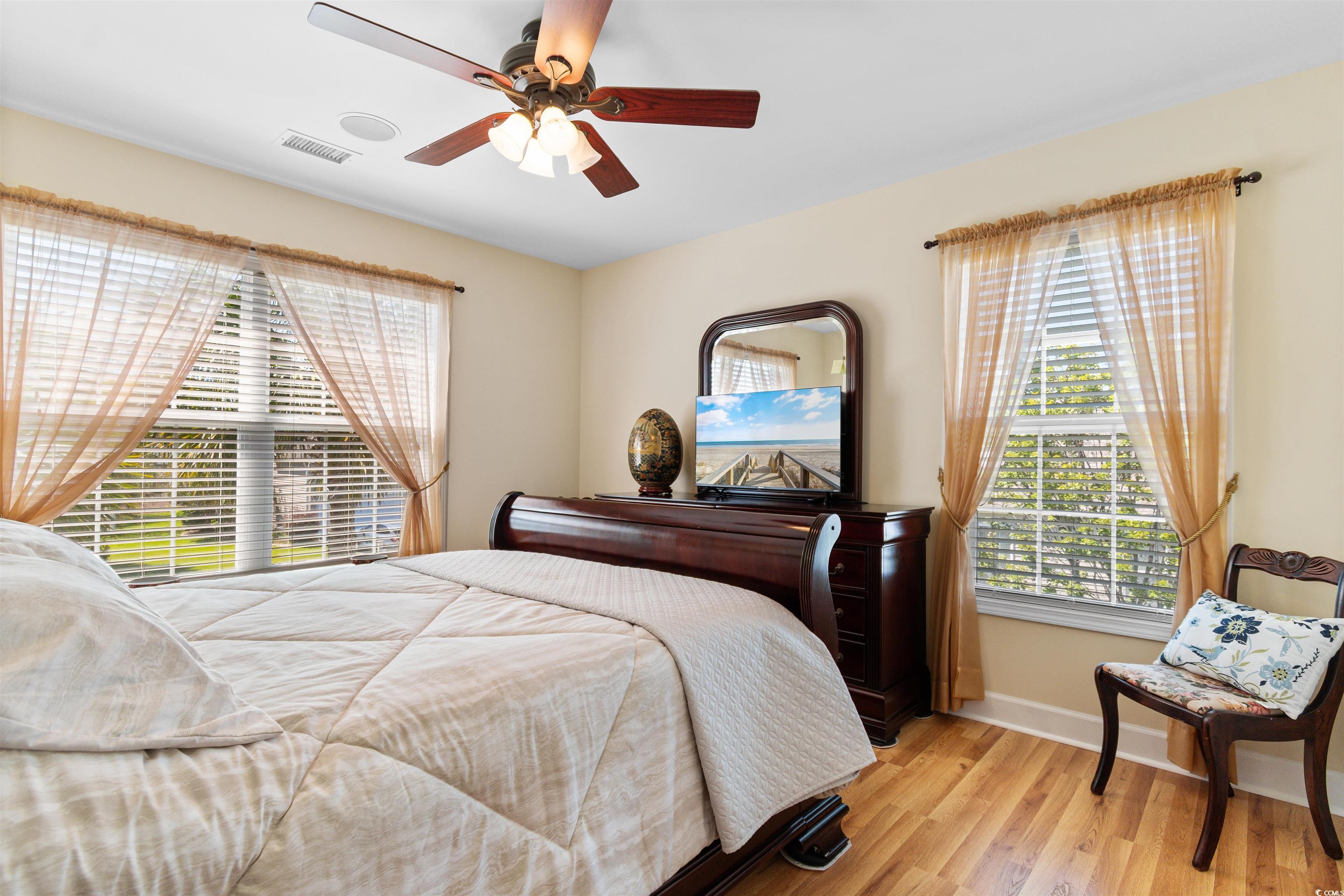 519 Heritage Point Drive Myrtle Beach, SC 29588 - Photo 22 of 39 Bedroom with wood finished floors and ceiling fan
