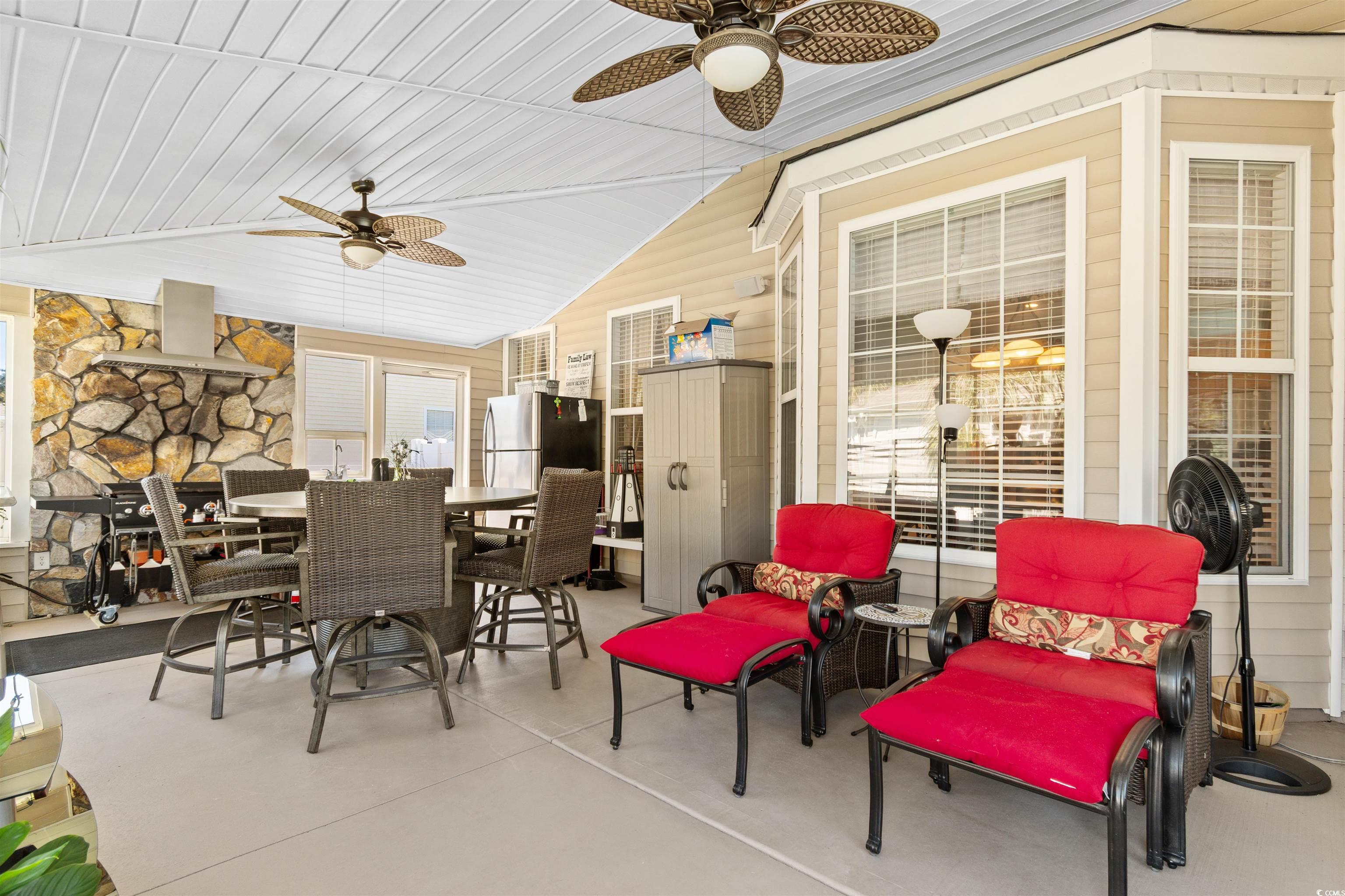 519 Heritage Point Drive Myrtle Beach, SC 29588 - Photo 26 of 39 View of patio / terrace featuring outdoor dining space and a ceiling fan