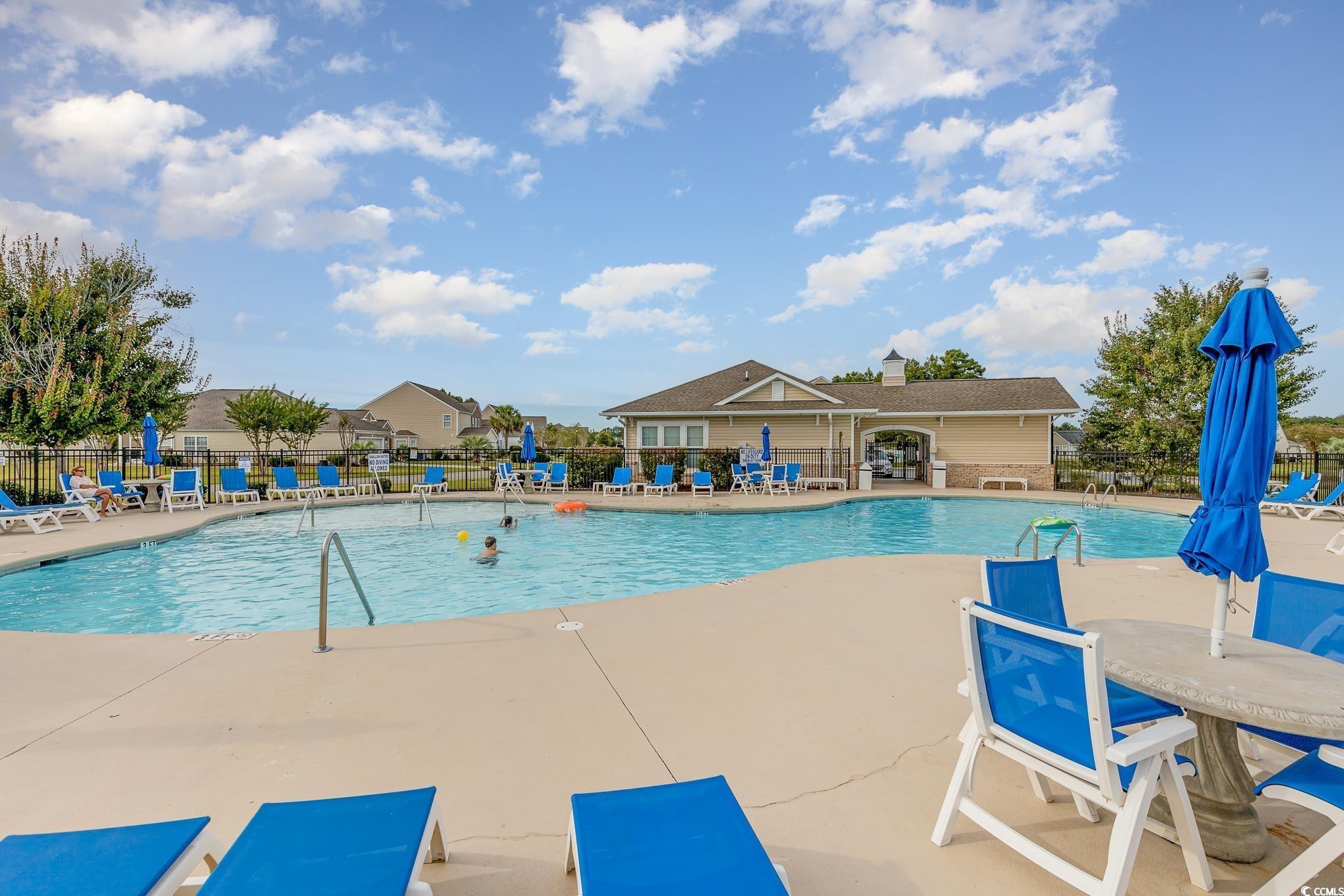 519 Heritage Point Drive Myrtle Beach, SC 29588 - Photo 32 of 39 Community pool with a patio area