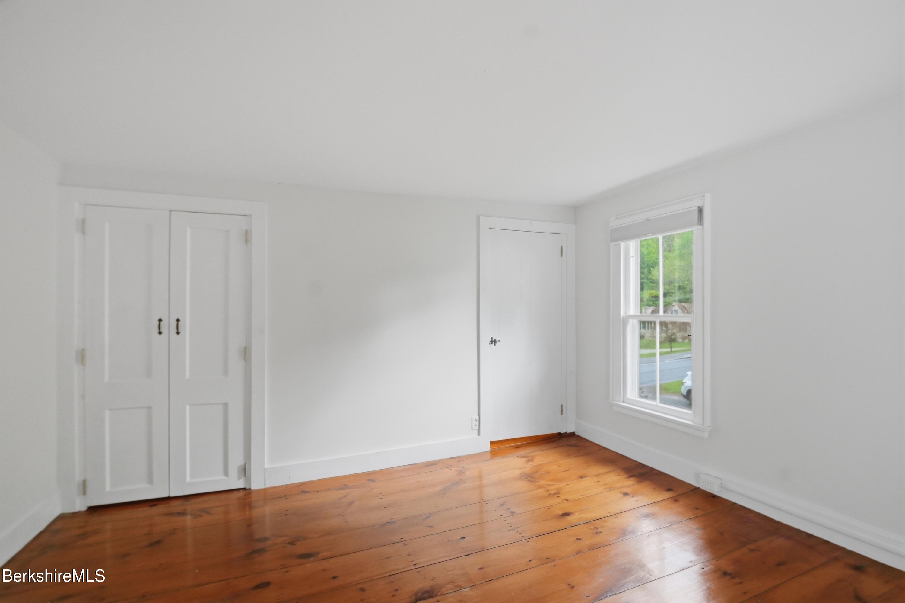4 Stockbridge Road West Stockbridge, MA 01266 - Photo 64 of 94 a view of an empty room with wooden floor and a window
